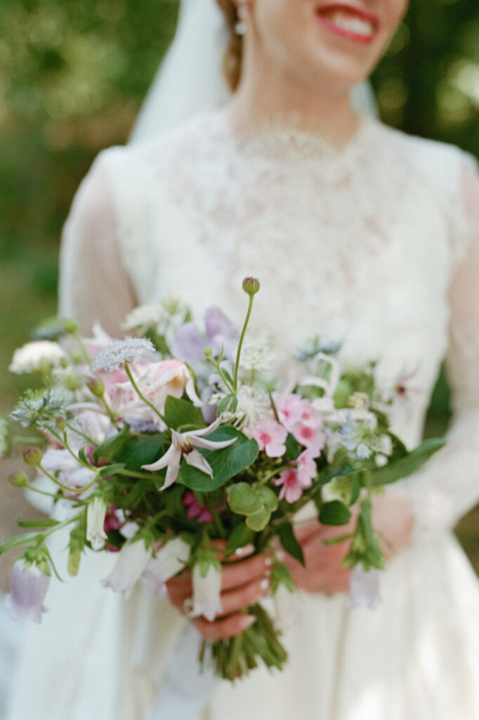 Loose garden-style bridal bouquet in blush, lilac, white and green by Capucine Atelier Floral.